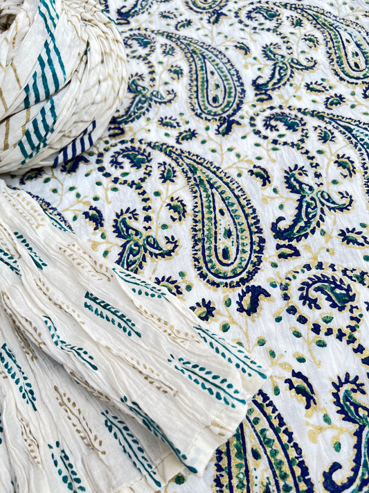 This gold and blue paisley design adds an elegant touch to our kora white fabric.