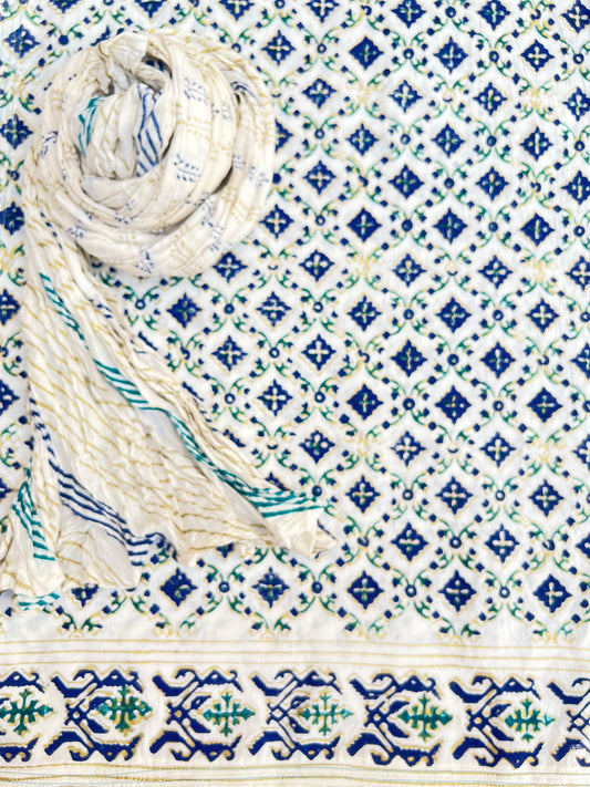 Gold Ferozi and Blue printed Gul-e-Nargis flower design on kora white fabric.